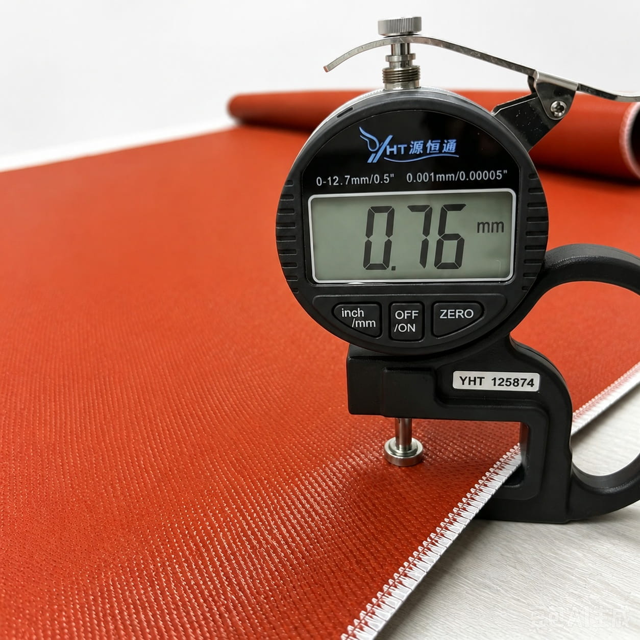 0.76mm 985gsm iron red double-sided silicone coated fiberglass fabric thickness measurement with digital gauge